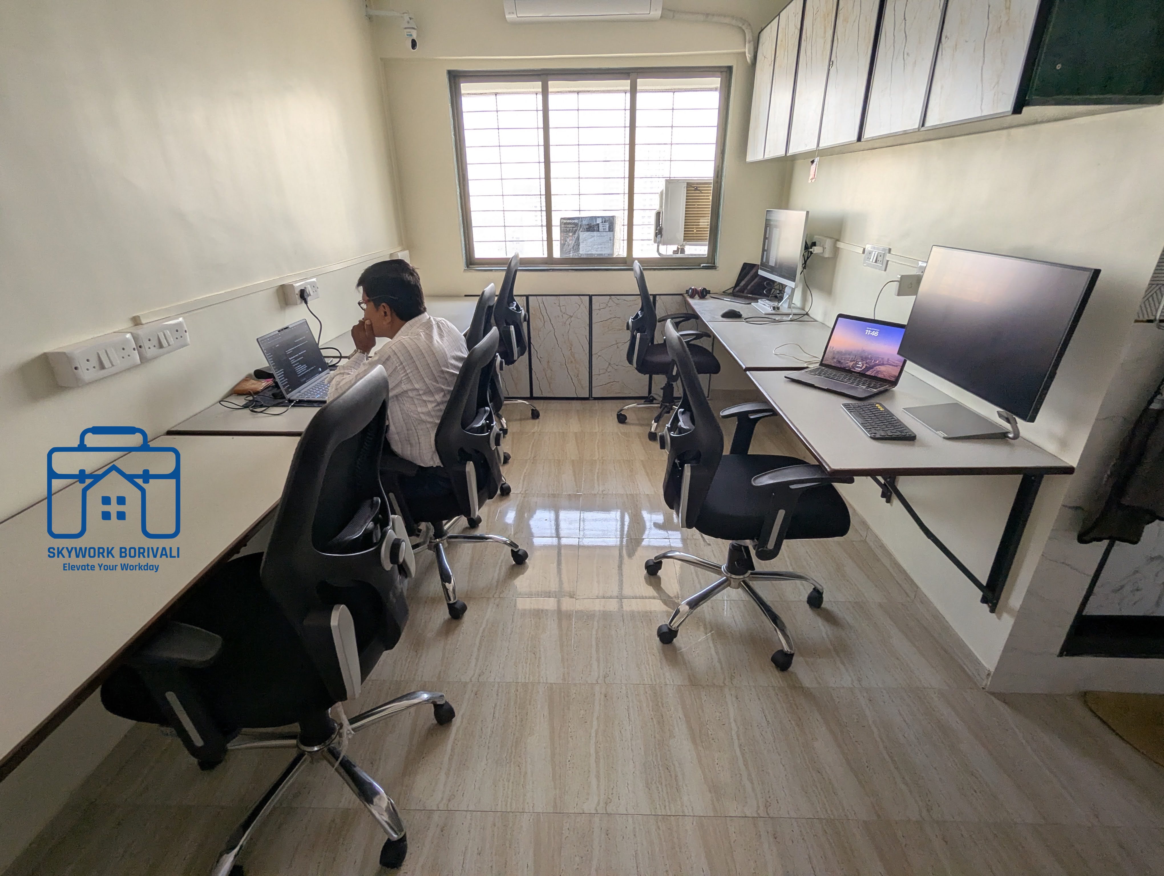 Shared desk area with dual monitor setup